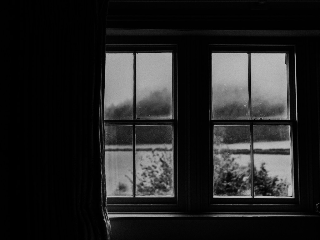 Photo Annie Spratt. Winter snow through windows. Moody winter scene.